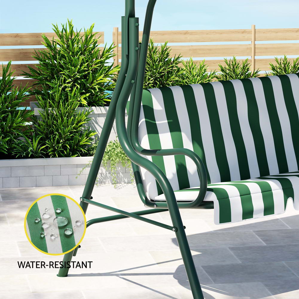 Close-up image of the side of a white and green Gardeon outdoor swing chair with a canopy and striped cushions, with an inset showcasing it is water resistant in an outdoor patio setting.
