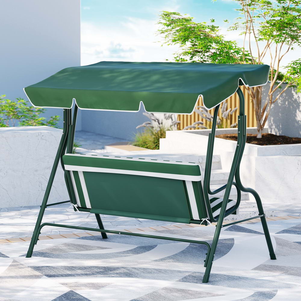 Back view of a white and green Gardeon outdoor swing chair with a canopy and striped cushions, garden setting.