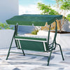Back view of a white and green Gardeon outdoor swing chair with a canopy and striped cushions, garden setting.