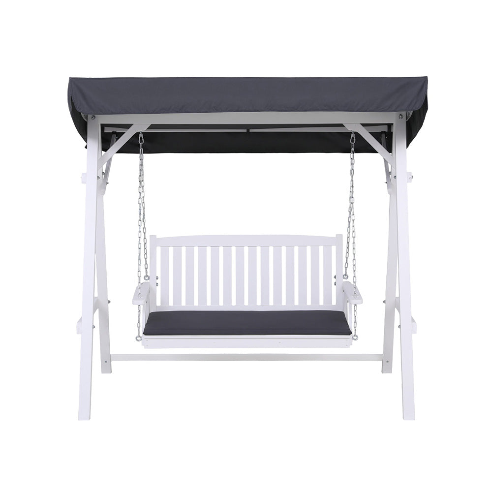 White outdoor swing with black cushions and canopy on a white background