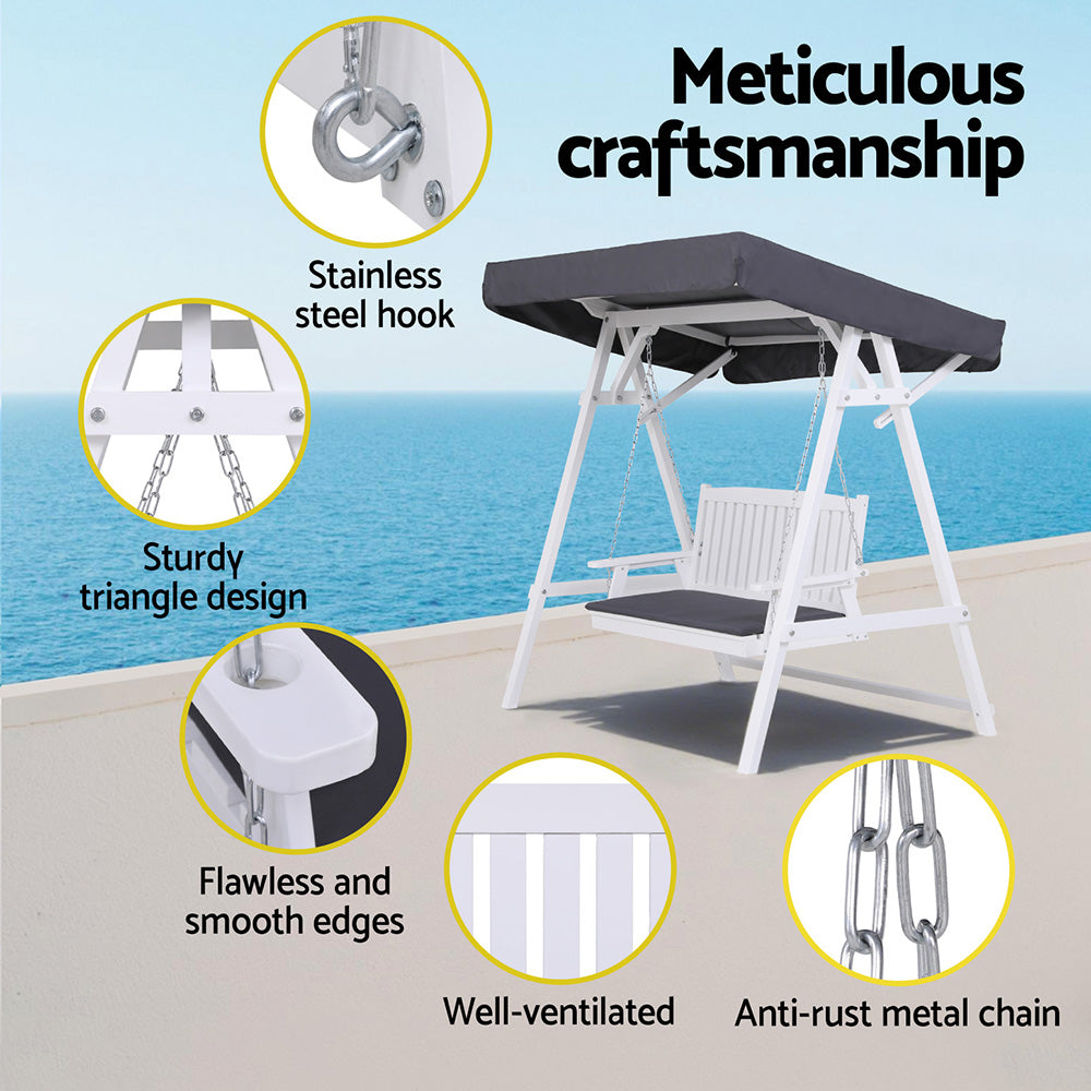 Outdoor swing with highlighted features against a blue sky background