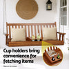 Wooden porch swing with cup holders on a white wall background
