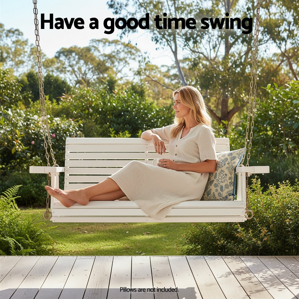 Woman sitting on a white wooden swing in a garden with text 'Have a good time swing'.