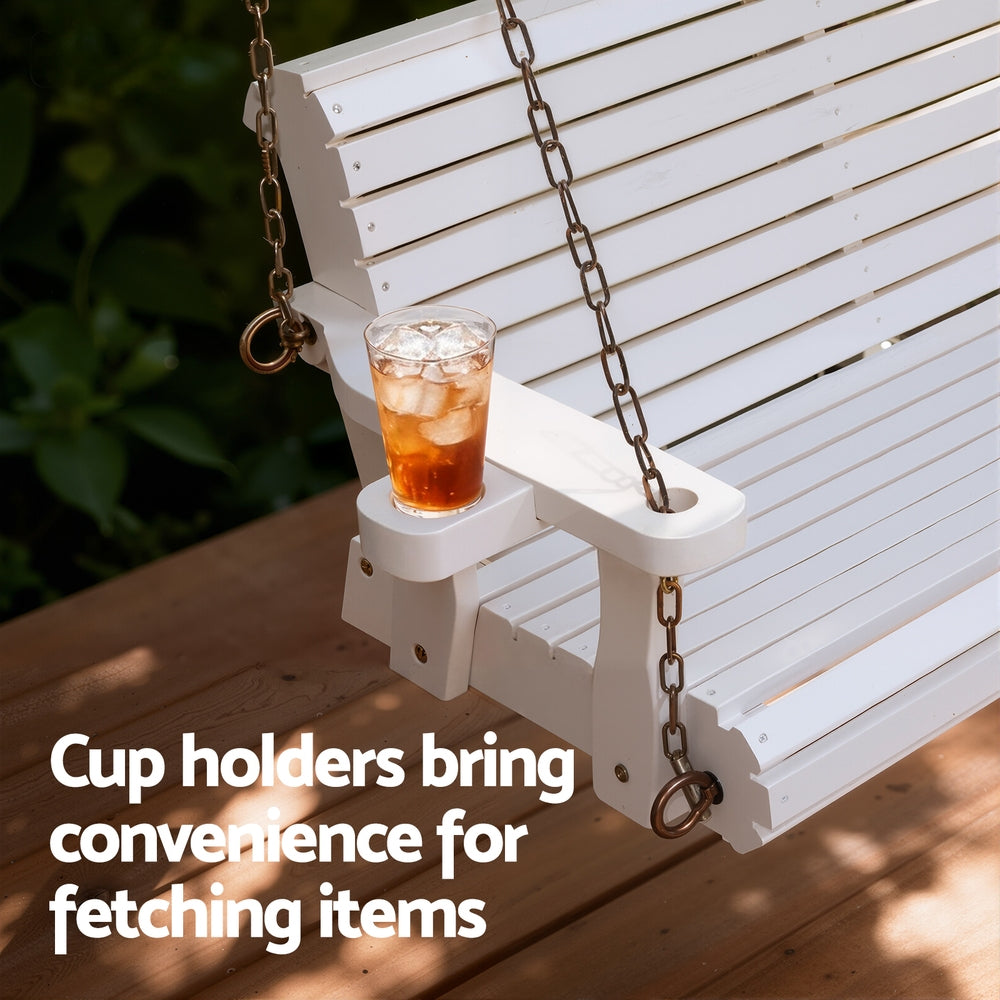 White wooden swing with a cup holder containing a drink on a wooden deck.