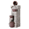 A brown, four-tier cascading water fountain feature set against a textured wall. With underwater LED lighting, made from polyresin, and on a white background.