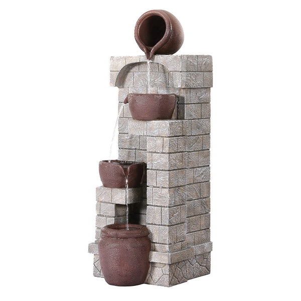 A brown, four-tier cascading water fountain feature set against a textured wall. With underwater LED lighting, made from polyresin, and on a white background.