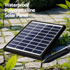 The solar panel to water fountain set up in a garden on some slate paving and small greenery growing between the pavers.