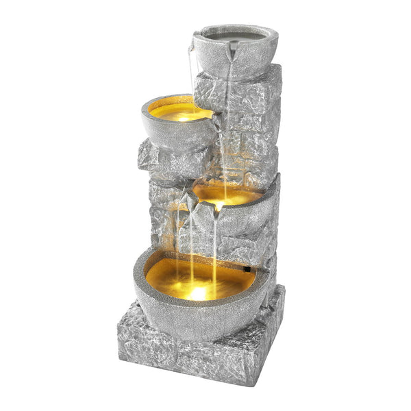 A grey, rock-style 4-tier cascading solar fountain with LED lights, featuring a solar panel on top and yellow led lights in the water in the basins.
