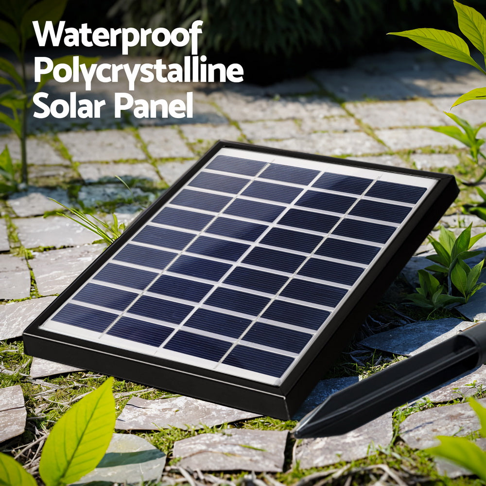 A close-up image showing the solar panel for water feature set in a garden on a slate paved area.