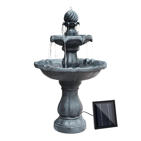 A three-tier black solar-powered water fountain with a visible solar panel and water cascading down the tiers.
