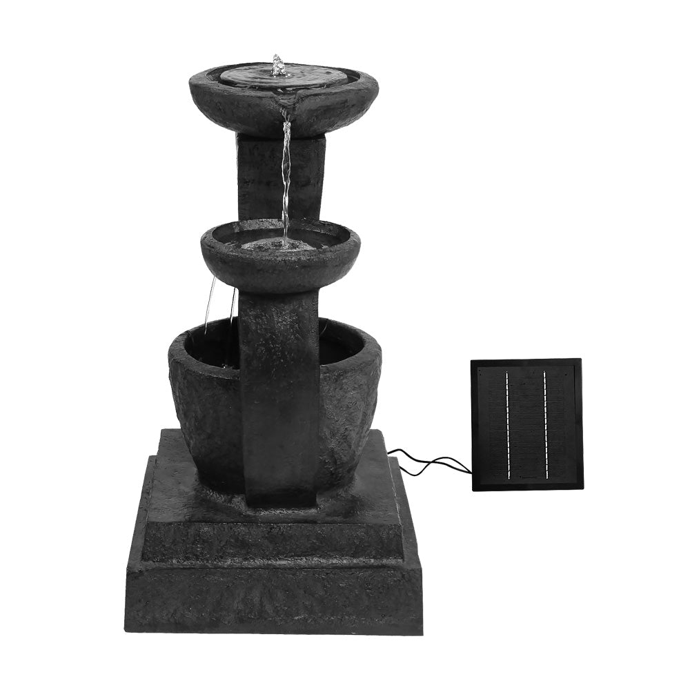 A three-tier cascading water feature with mushroom bowls, in black colour featuring a solar panel on the top right, all set against a white background.
