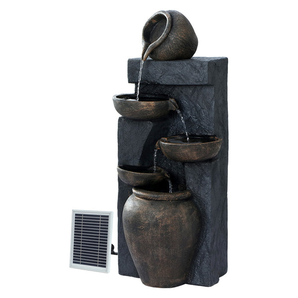 A brown and copper toned, cascading fountain with five tiered bowls and a solar panel on the side all set against a white background.