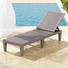 Gray lounge chair by a pool