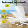 White lounge chair with customizable backrest angle on a wooden deck by the ocean.