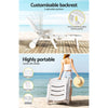 A 2-way split image of a white Gardeon folding sun lounger with wheels. One in a reclined position showing it has 5 adjustable backrest positions, the other with a lady wheeling the chair and showcasing its portability, both images in a beach setting.