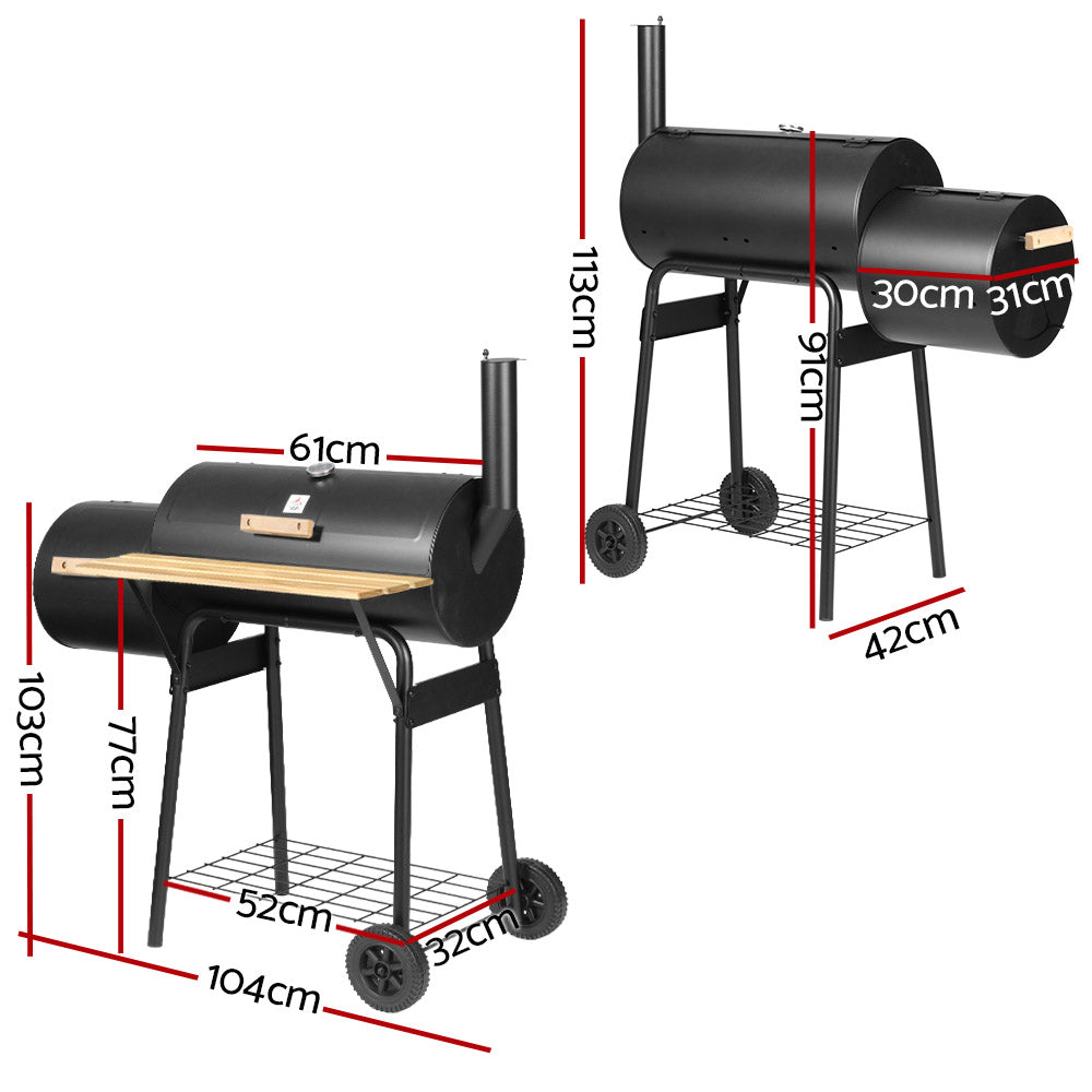 A black Grillz 2-in-1 offset charcoal smoker with a chrome-coated steel BBQ grill on top and a side firebox. It has a large front shelf, two wheels for mobility, showing its dimensions and set on a white background.