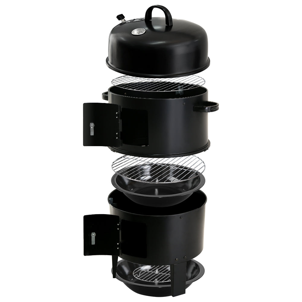 A black 3-in-1 charcoal BBQ smoker showcasing all its individual pieces including a lid, grills, side doors, and a front-mounted temperature gauge, set on a white background.