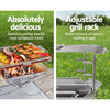 A 2-way split image showcasing Grillz gas BBQs dimensions of the stainless-steel grill rack with steak, sausage, chicken wings and vegetables cooking on a table in a garden setting and the other image being a close-up  showcasing the adjustable grill rack, also in a garden setting.