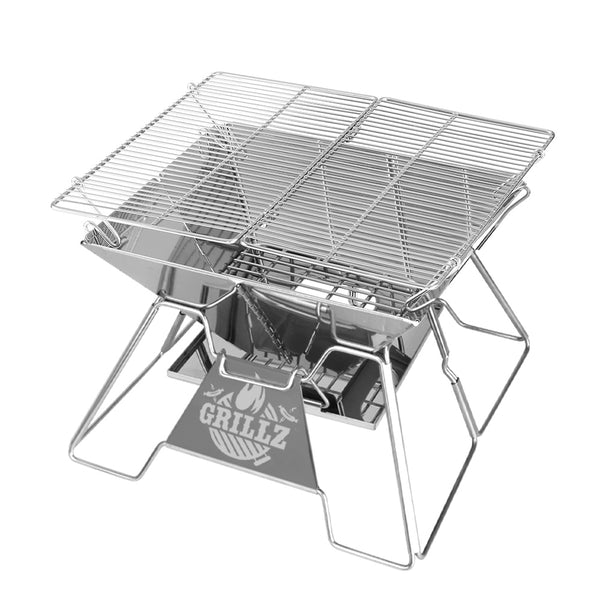 A portable stainless steel fire pit BBQ grill with a carry bag. It features a grill rack and an ashtray. Set on a white background.