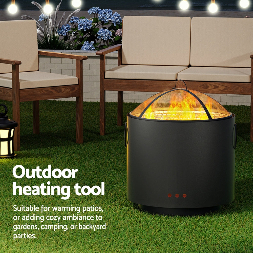 Outdoor heating tool on a grassy area with patio furniture and plants in the background.