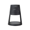 Black perforated stool on a white background