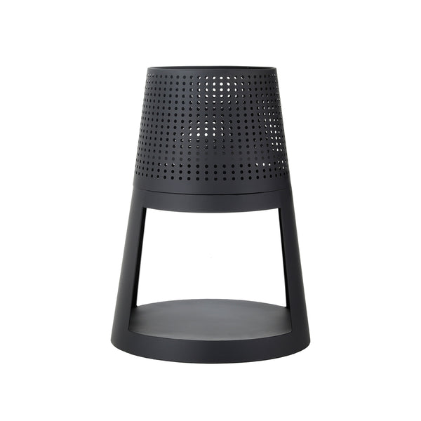 Black perforated stool on a white background
