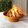 rust coloured fire pit with flames on a patio