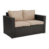 Two-seater outdoor sofa with beige cushions on a white background