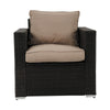 Brown wicker armchair with beige cushions on a white background