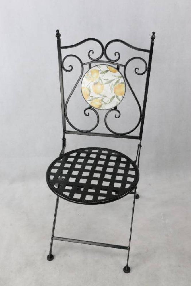 Black metal chair with decorative backrest on a light gray background