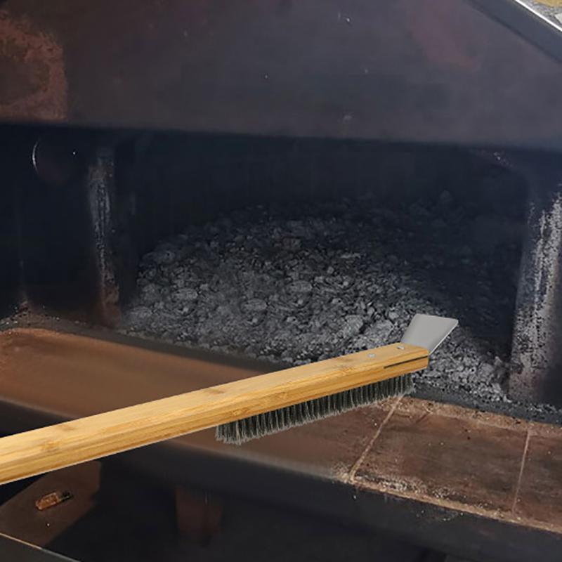 Bristle brush on a grill with glowing coals inside