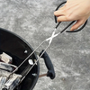 Person using tongs to handle charcoal in a grill
