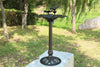 Decorative outdoor bird bath in a garden setting