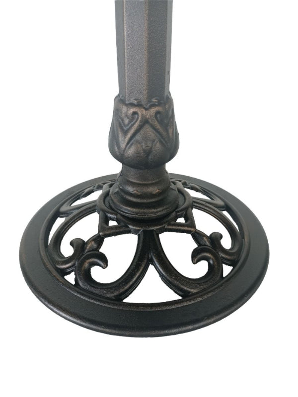 Decorative metal pedestal base on a white background