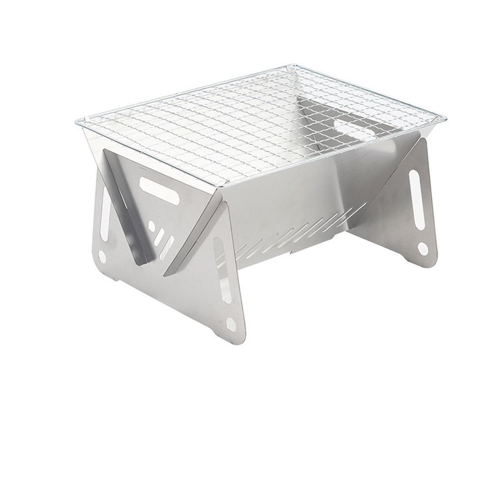 Portable metal grill on a white background