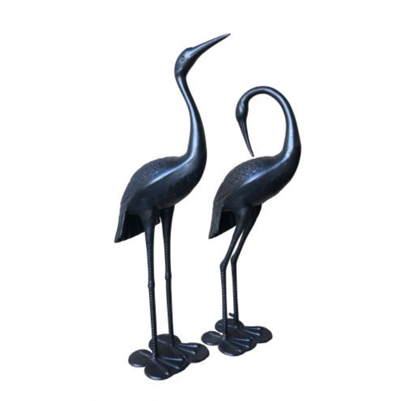 Niles & Frasier Pair of Garden Ornamental Cranes one standing up and one with its neck bent backwards, on a white background.
