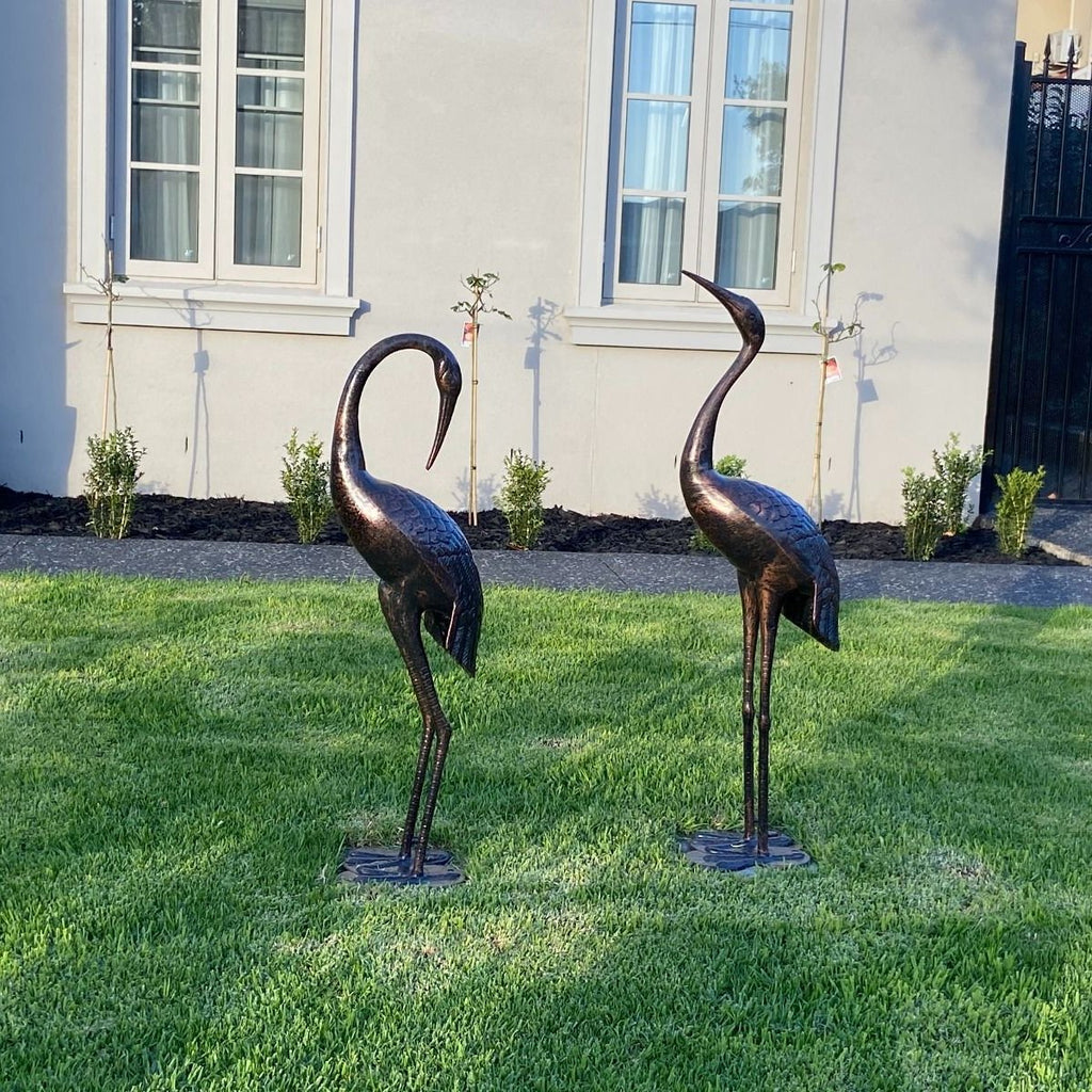 Niles & Frasier Pair of Garden Ornamental Cranes looking at home in someone's front garden
