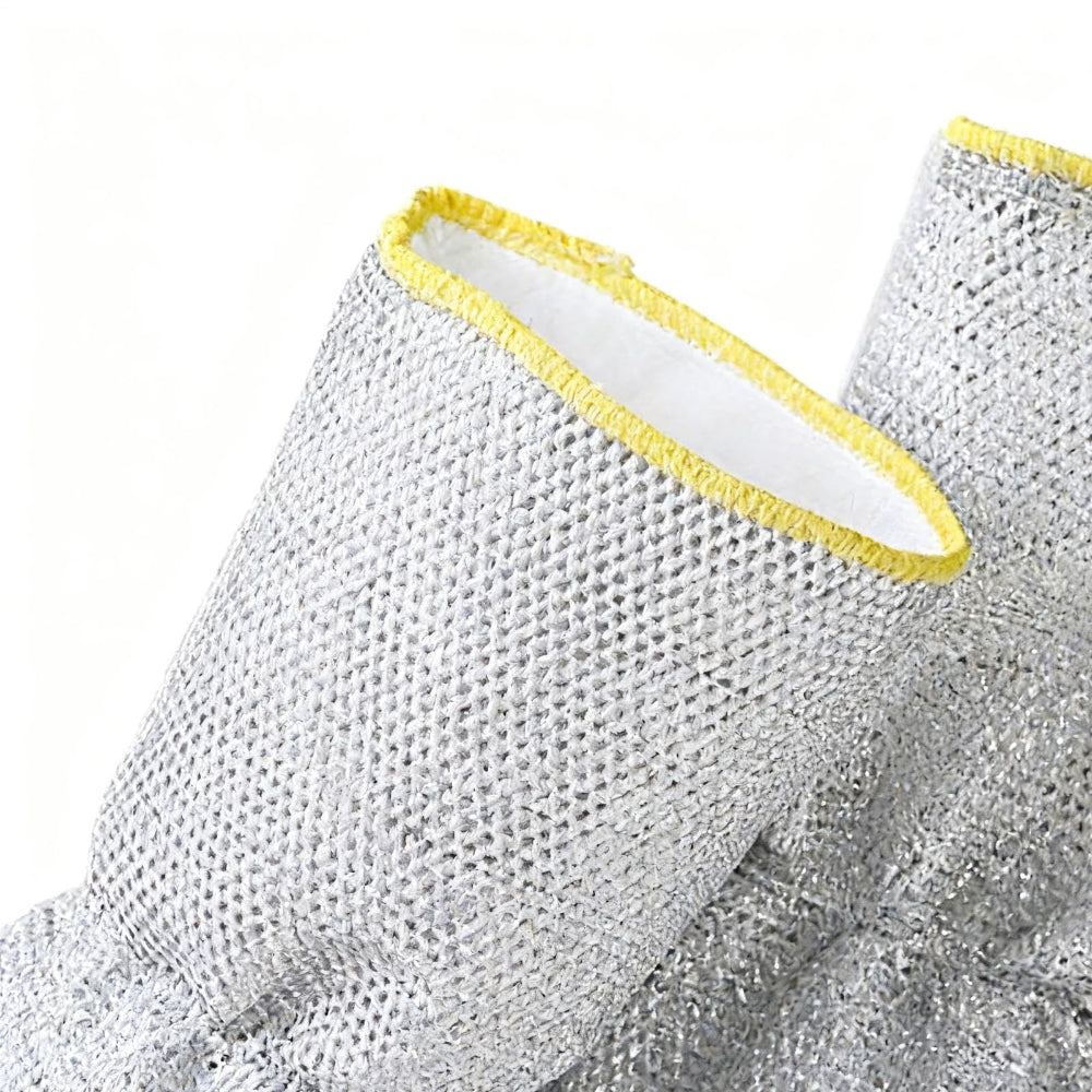 Close-up of a gray mitten with yellow trim on a white background