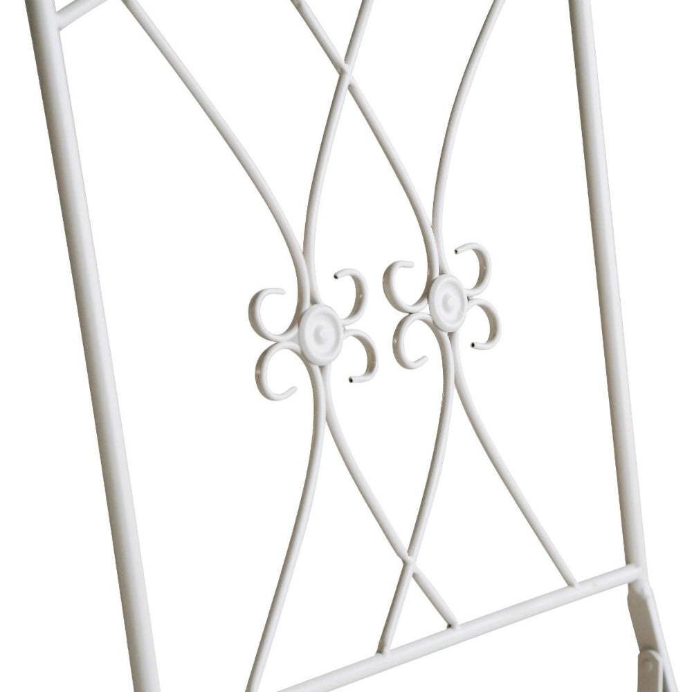 Close-up of a white metal decorative frame with intricate patterns on a white background