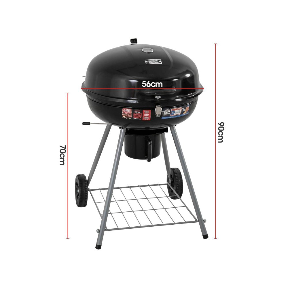 Portable charcoal BBQ smoker with an enameled firebowl and lid, in a tripod design. It has wheels and a storage shelf underneath, showing it's dimensions and set on a white background.