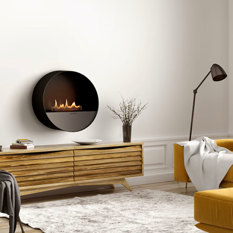 Modern living room with a round wall-mounted fireplace, wooden console table, and yellow sofa.