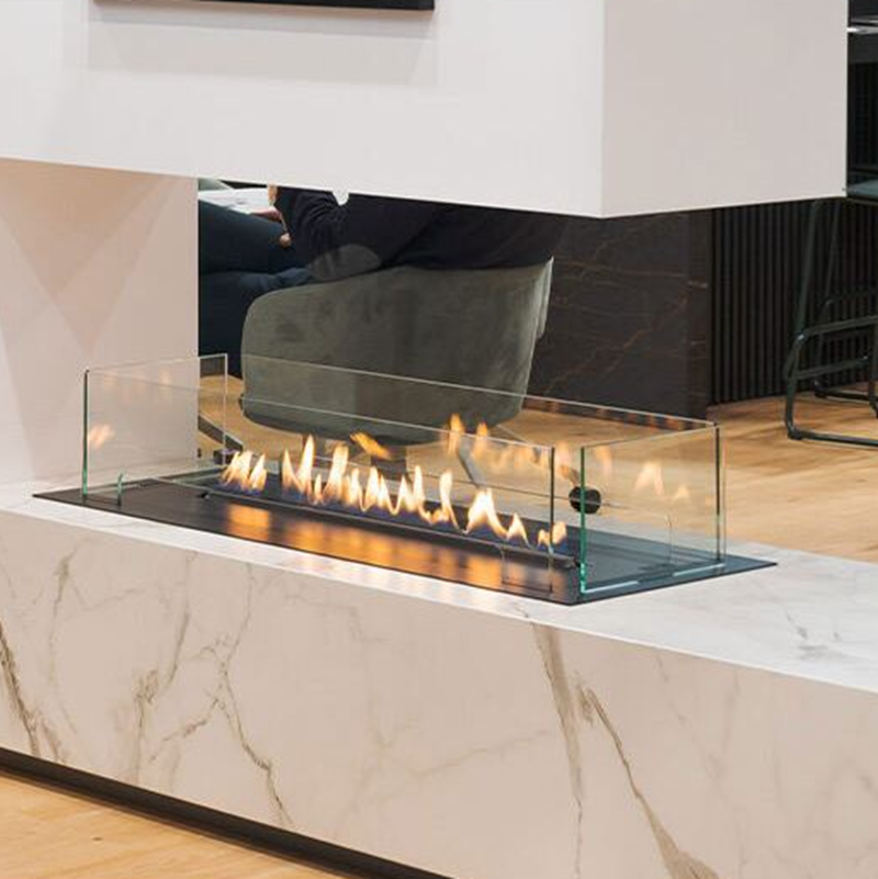 Modern electric fireplace with glass front on a marble countertop