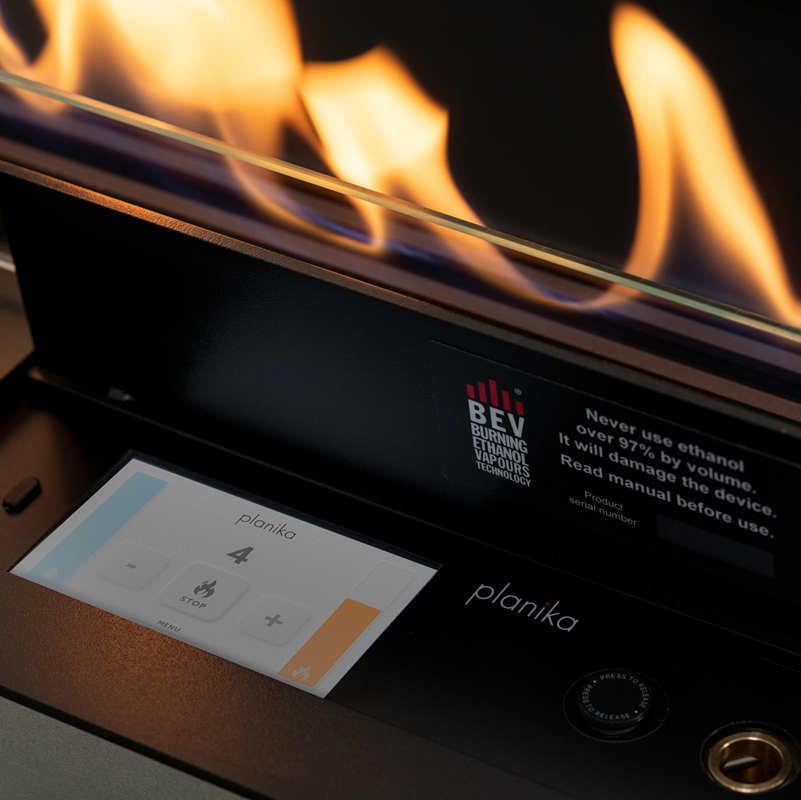 Planika ethanol burner with flames and digital display on a black background