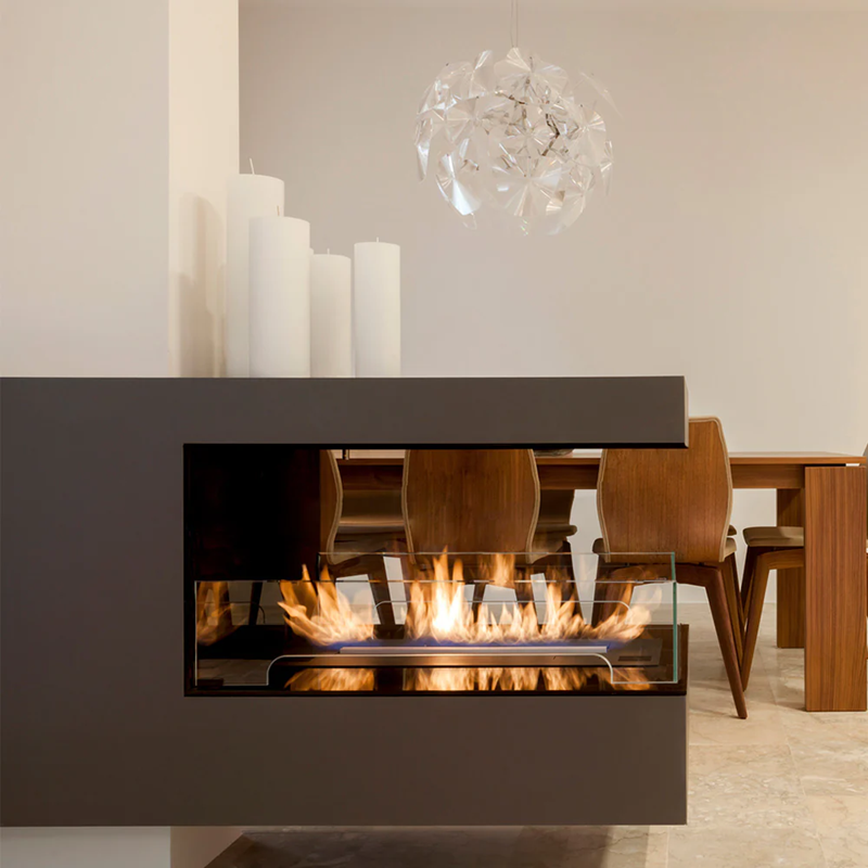 Modern fireplace with flames in a dining room setting