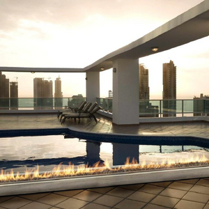 Galio Gas Fire Pit Insert Linear Automatic with fire burning at a rooftop poolside