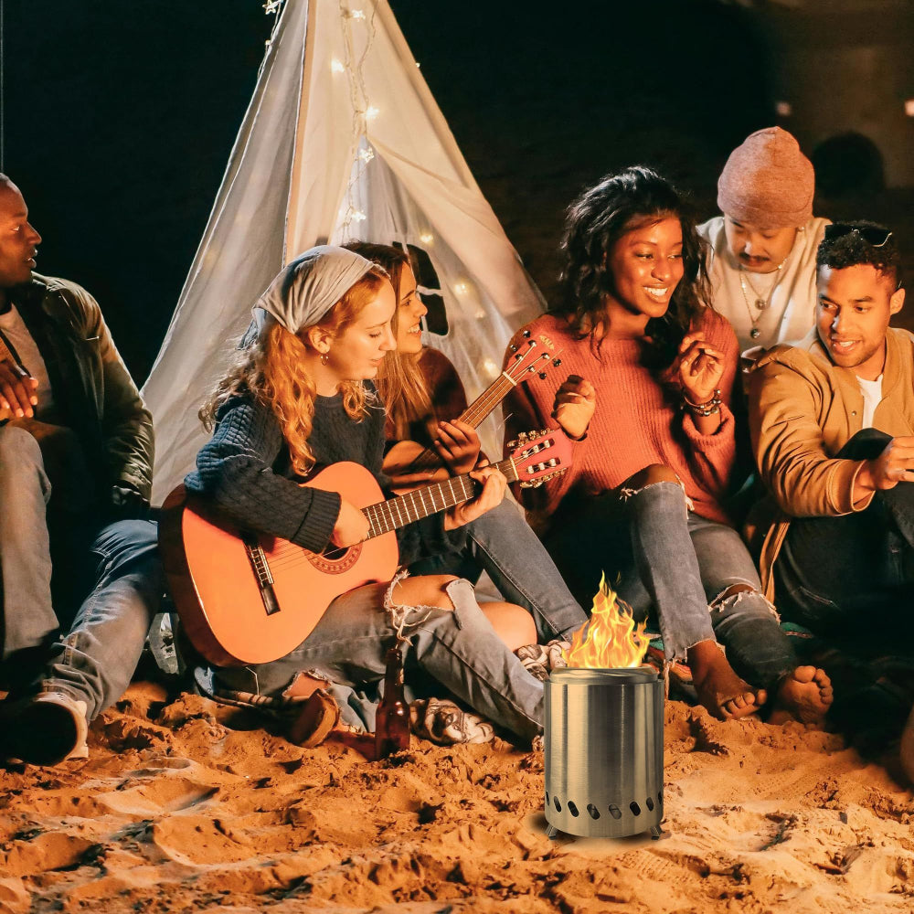 Group of friends sitting around a campfire with a teepee in the background