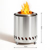 Stainless steel fire pit with flames on a white background