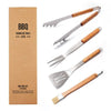 Set of four barbecue tools with wooden handles and a cardboard box labeled 'BBQ Barbecue Tools'.