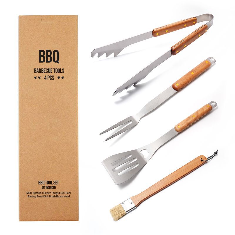Set of four barbecue tools with wooden handles and a cardboard box labeled 'BBQ Barbecue Tools'.
