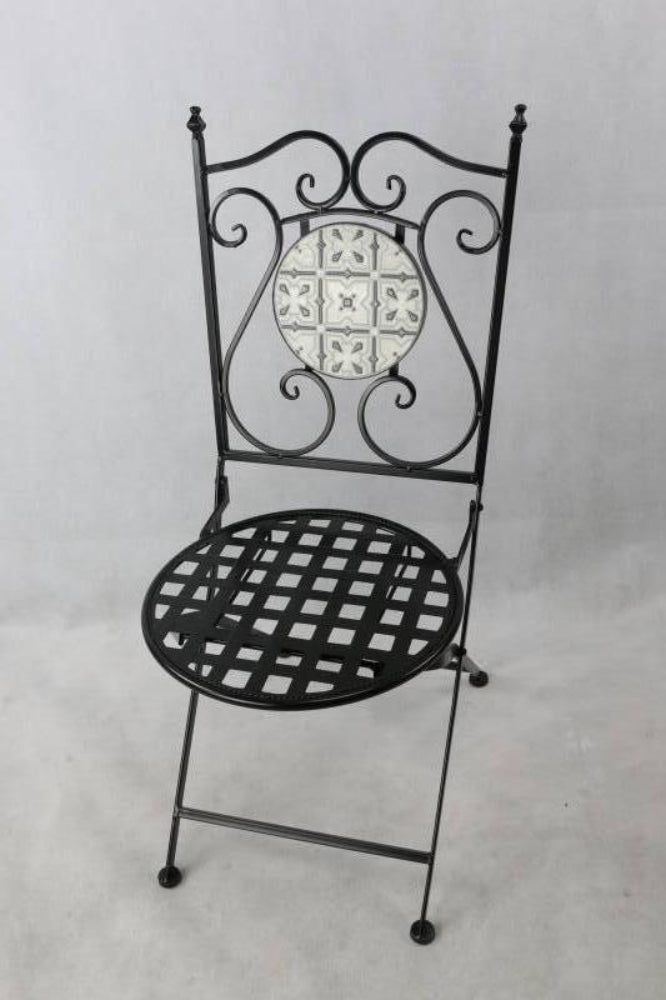 Decorative black metal chair with lattice seat and tiled backrest on a light gray background